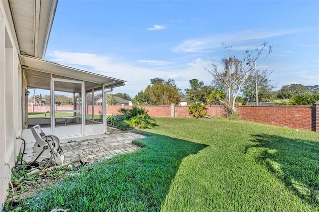 view of yard featuring a sunroom