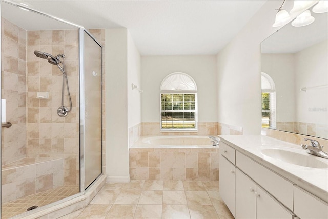 bathroom with separate shower and tub, tile patterned flooring, and vanity