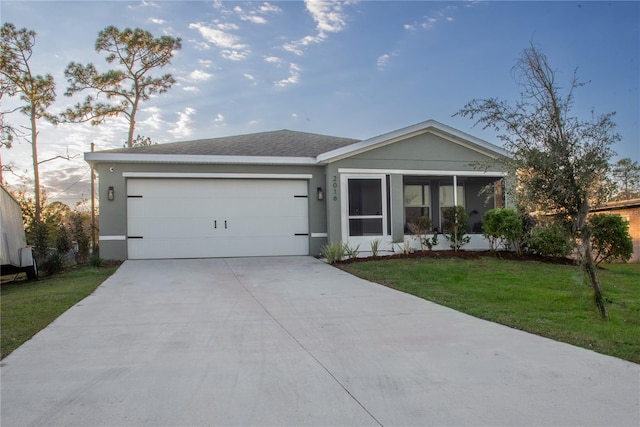 ranch-style house with a front lawn and a garage