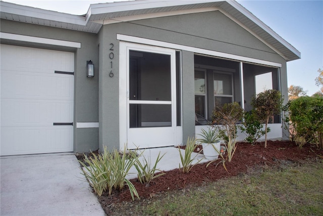 entrance to property featuring a garage