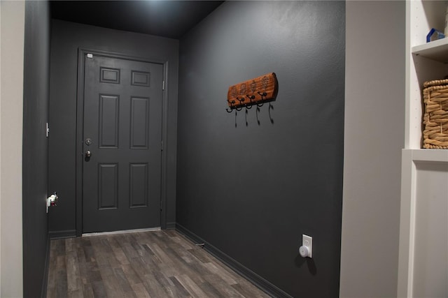 doorway with dark hardwood / wood-style flooring