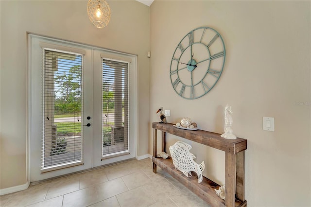 entryway featuring french doors and light tile patterned flooring