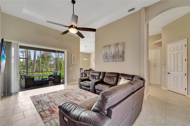 tiled living room featuring ceiling fan