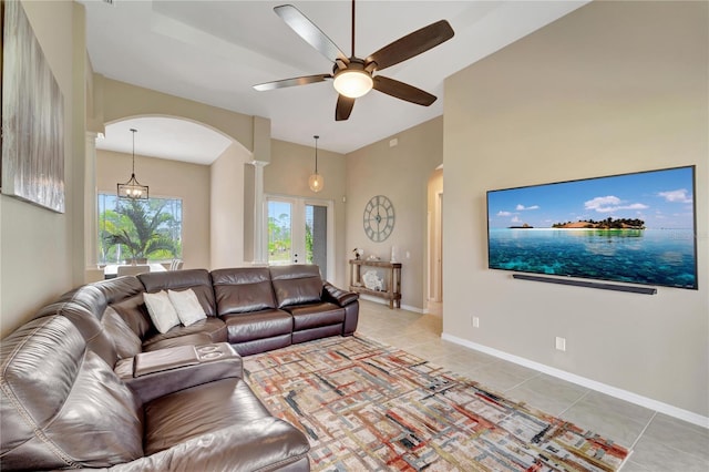 living room featuring ceiling fan and tile patterned flooring