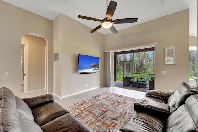 tiled living room featuring ceiling fan