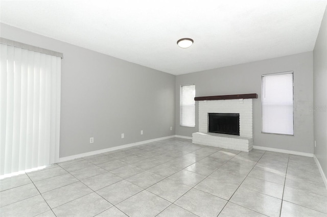 unfurnished living room featuring light tile patterned floors and a fireplace