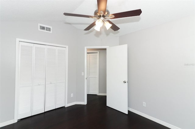 unfurnished bedroom featuring a closet, ceiling fan, and lofted ceiling