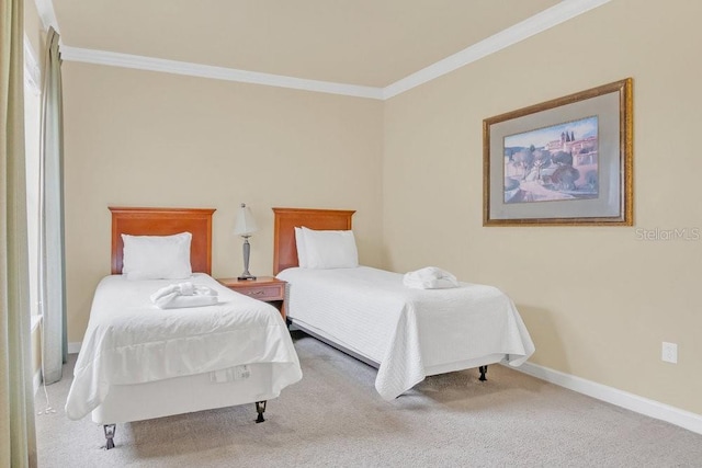 bedroom featuring ornamental molding and carpet flooring