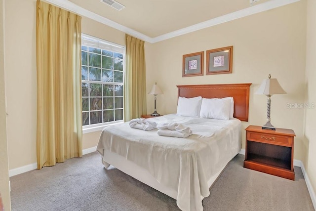 carpeted bedroom featuring crown molding