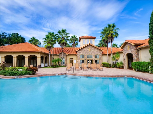 view of pool featuring a patio