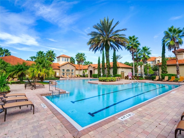 view of swimming pool with a patio area