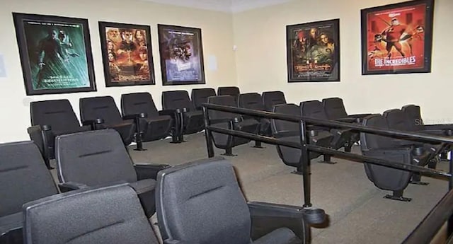 cinema room featuring ornamental molding