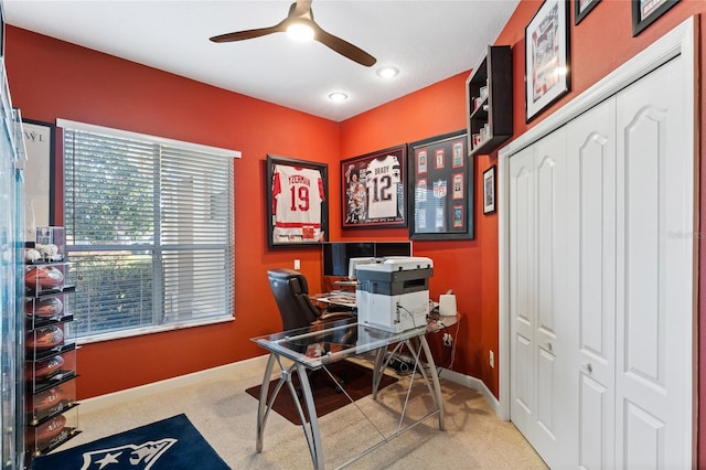 office area with ceiling fan and carpet flooring