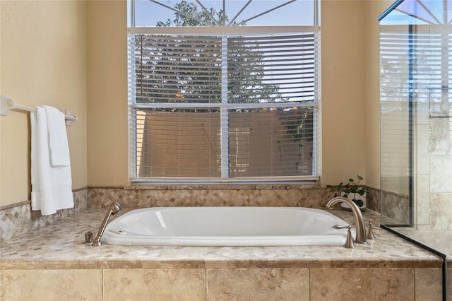 bathroom with tiled tub