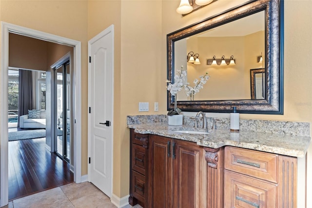 bathroom with vanity and tile patterned flooring