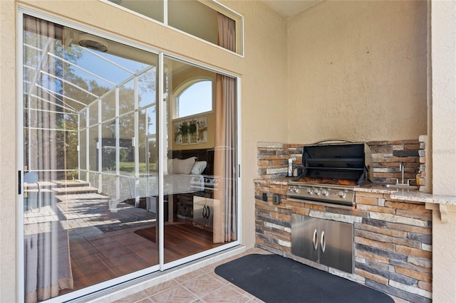 doorway to property featuring an outdoor kitchen and sink