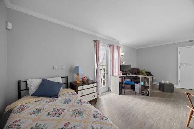 bedroom featuring wood-type flooring and ornamental molding