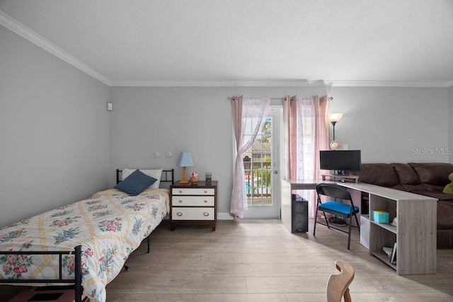 bedroom featuring access to exterior, ornamental molding, and hardwood / wood-style flooring