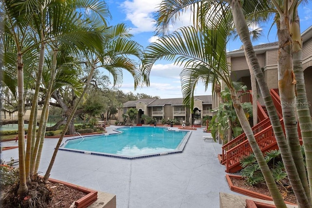 view of pool featuring a patio