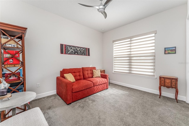 living room with ceiling fan and carpet flooring