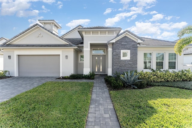 view of front facade with a garage and a front yard