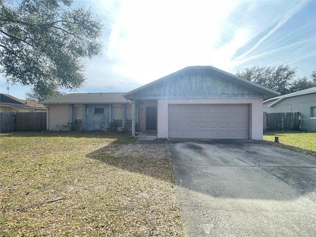 ranch-style house with a front lawn and a garage