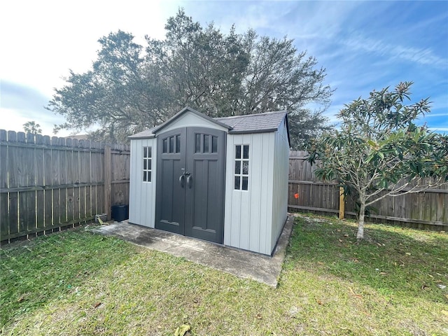 view of outdoor structure featuring a lawn