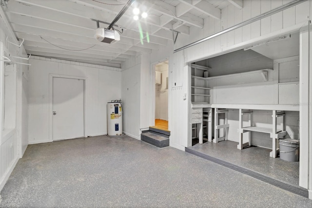 garage featuring a garage door opener and electric water heater