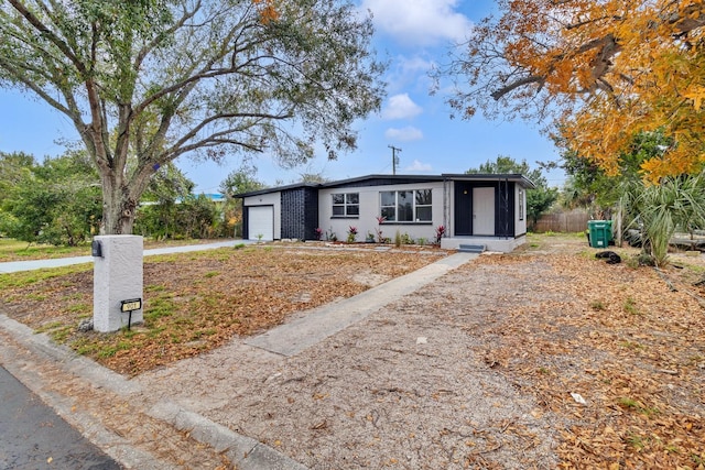 ranch-style house featuring a garage