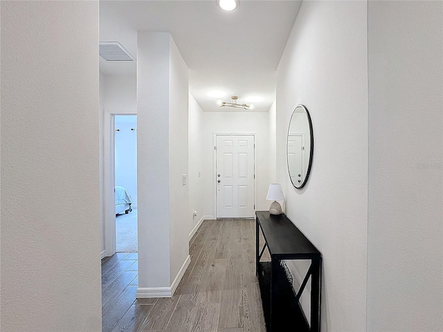 hallway featuring light hardwood / wood-style floors