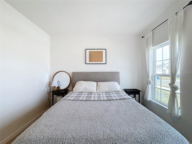 bedroom featuring multiple windows