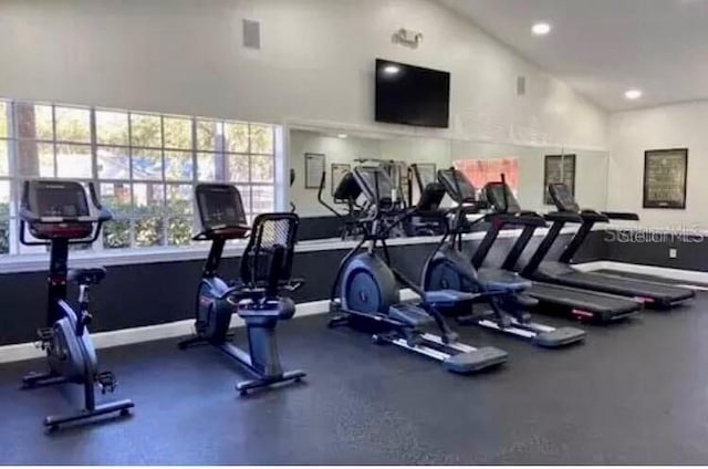 workout area with lofted ceiling