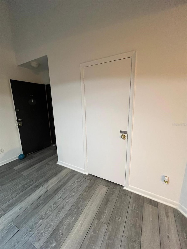 empty room with hardwood / wood-style floors