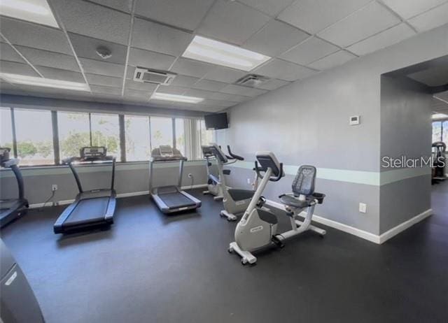 gym featuring a paneled ceiling