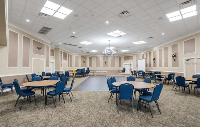 carpeted dining area featuring a paneled ceiling and an inviting chandelier