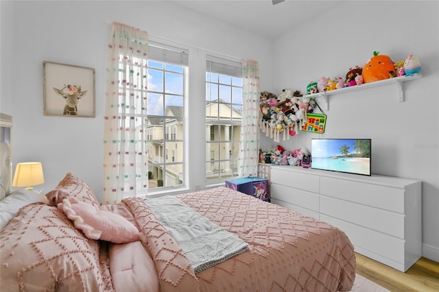 bedroom with light hardwood / wood-style flooring