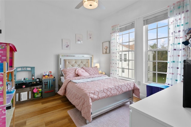 bedroom featuring ceiling fan and light hardwood / wood-style floors