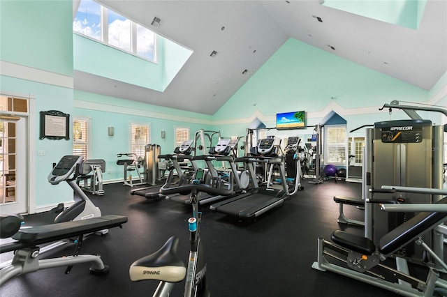 exercise room with high vaulted ceiling