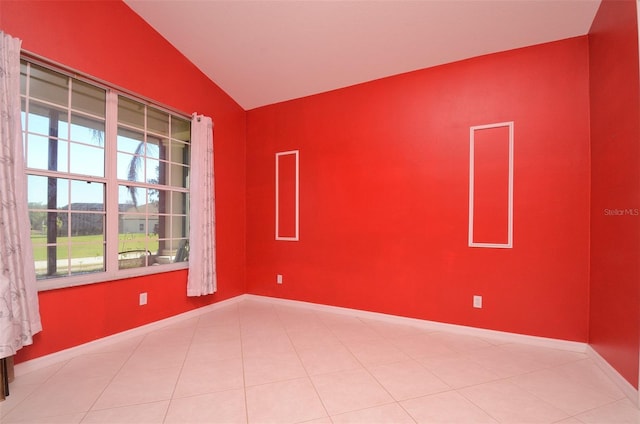 empty room featuring vaulted ceiling