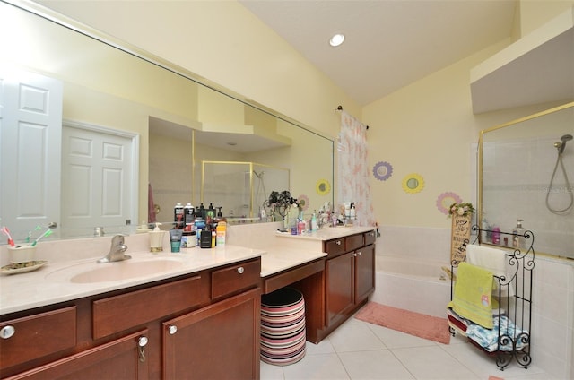 bathroom featuring separate shower and tub, vanity, and tile patterned floors