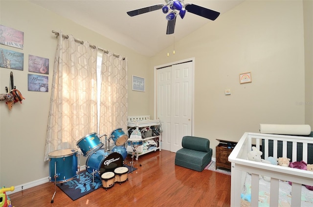 bedroom featuring a closet, lofted ceiling, hardwood / wood-style floors, and ceiling fan