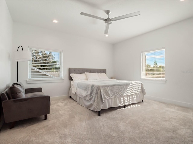 carpeted bedroom featuring ceiling fan