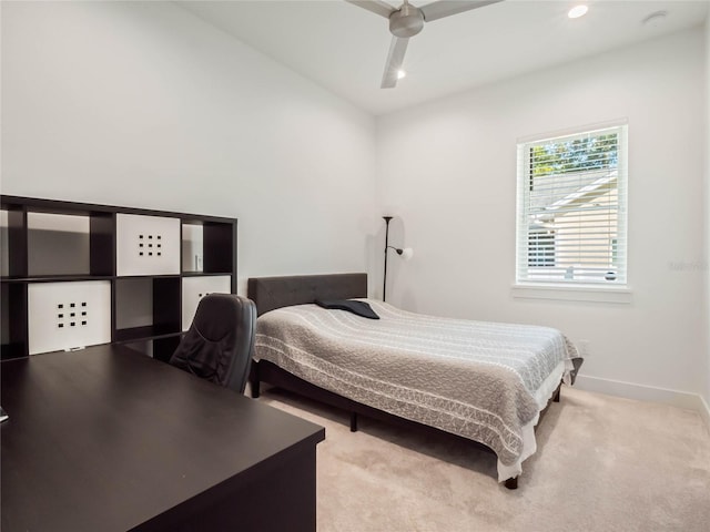 bedroom featuring ceiling fan and light colored carpet