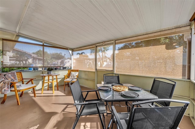 sunroom featuring lofted ceiling