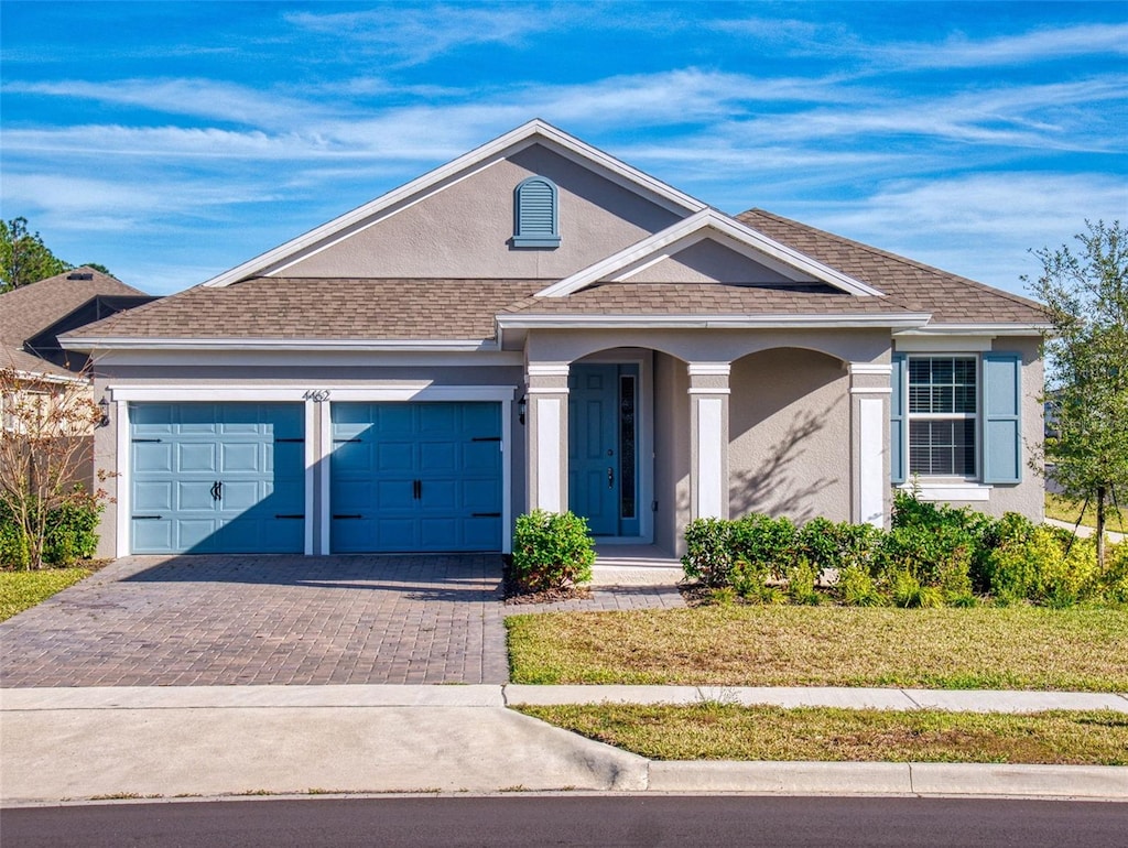 single story home featuring a garage