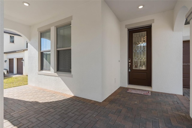 doorway to property featuring a garage