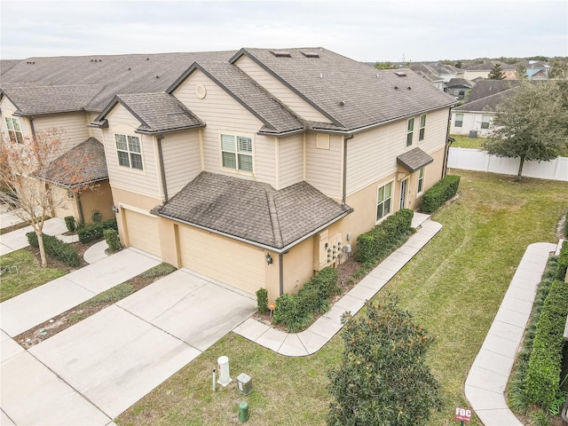 exterior space featuring a front yard and a garage