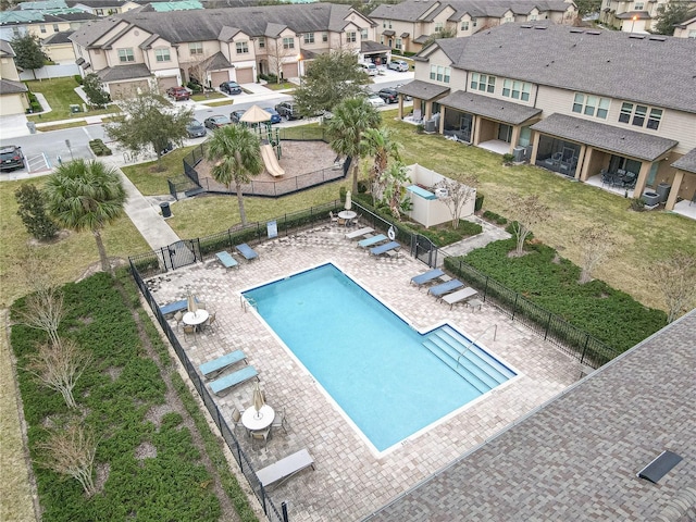 view of swimming pool with a patio and a lawn