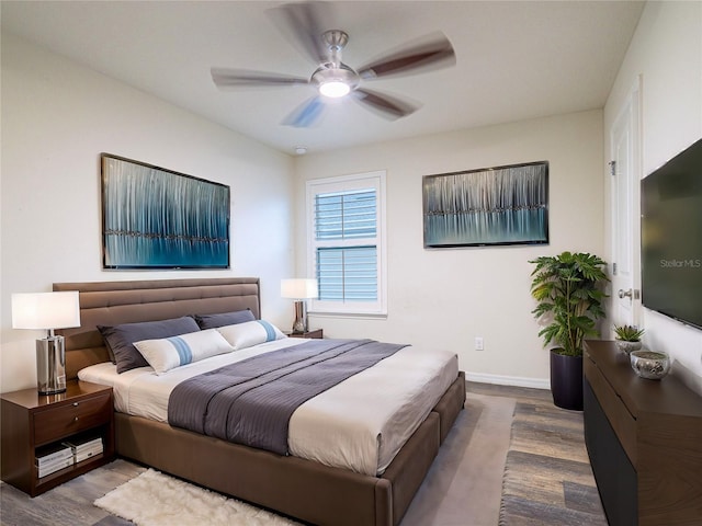 bedroom featuring ceiling fan and hardwood / wood-style flooring