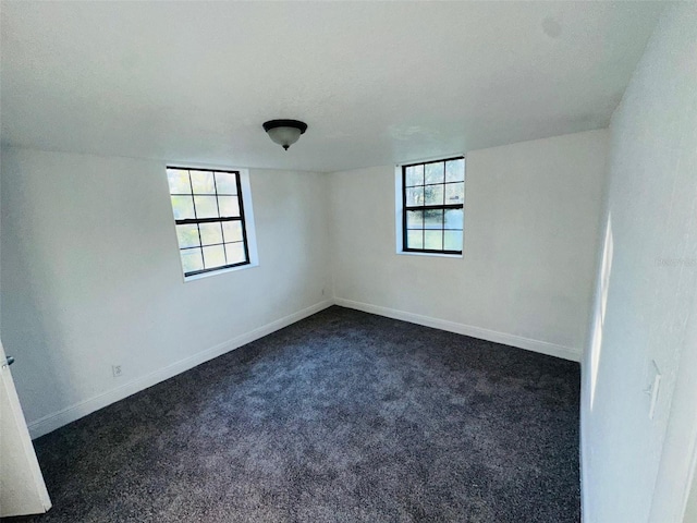 carpeted spare room with plenty of natural light